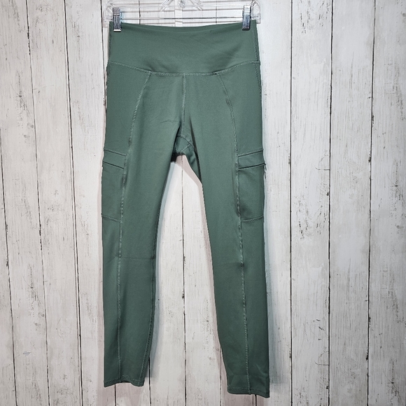 Move Theology Pants - Move Theology Women's Green 7/8 Length Leggings Zip Pockets Size Medium.